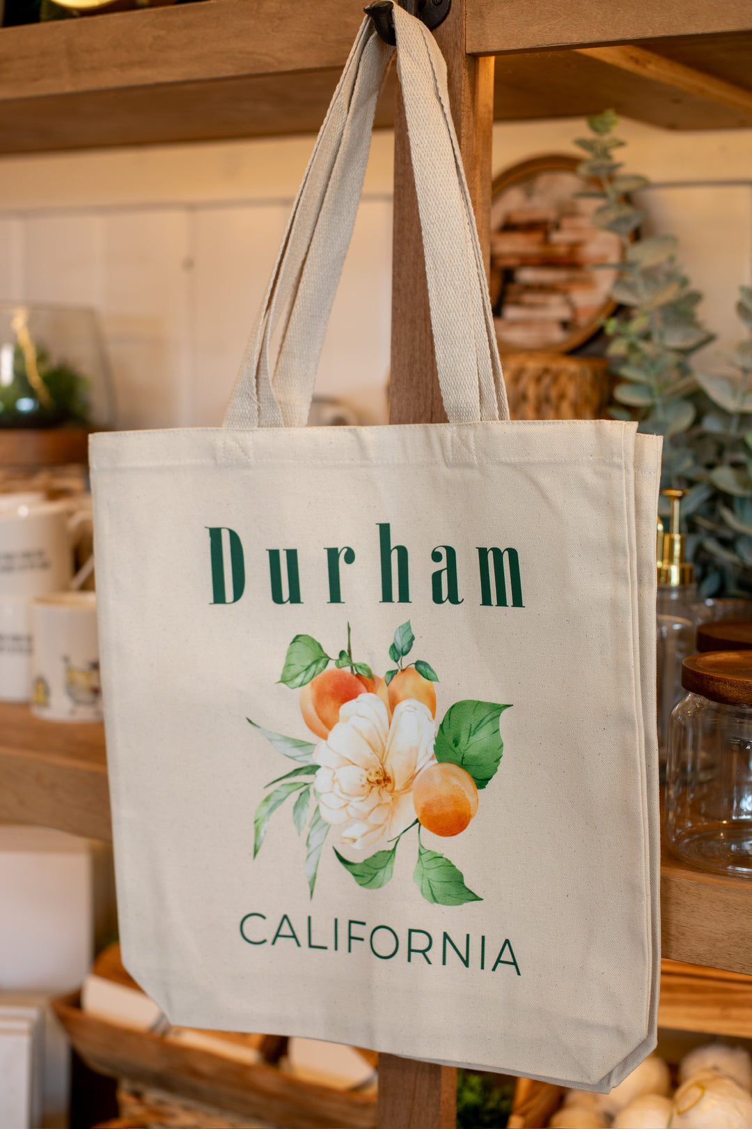 Beige tote bag with floral design and &