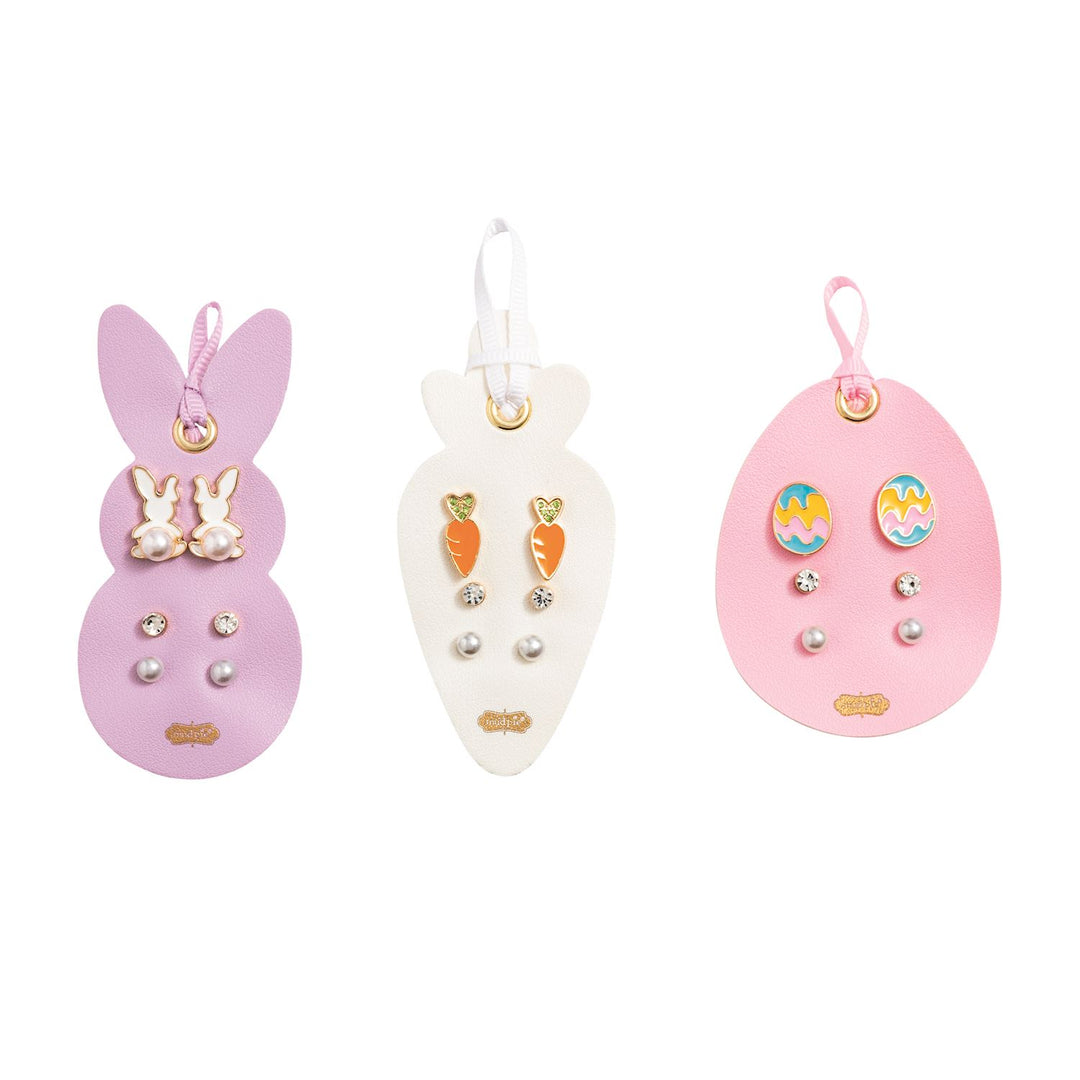 Set of three pairs of earrings on a white background