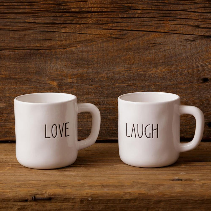 Two white mugs with &