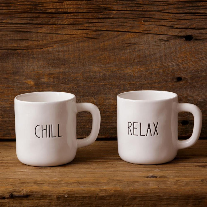 Two white mugs with &