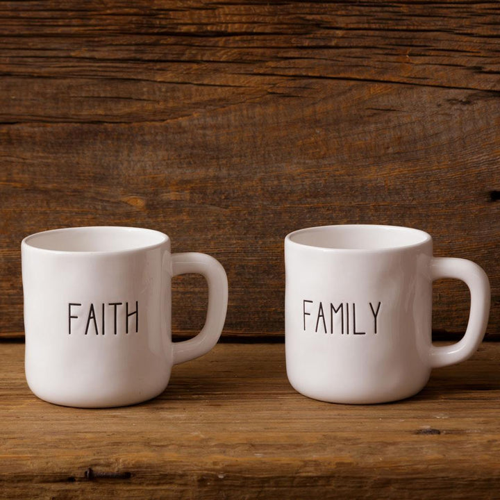 Two white mugs with &