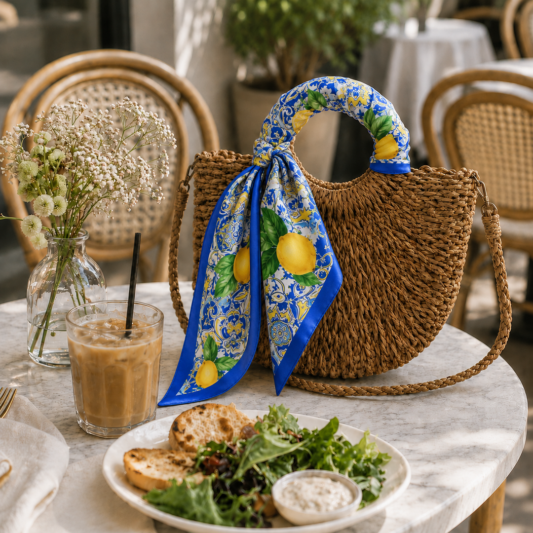 Woven bag with a colorful scarf on a table with food and drink