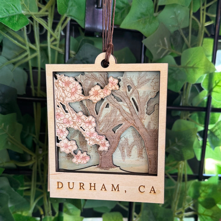 Wooden hanging ornament with floral design and &