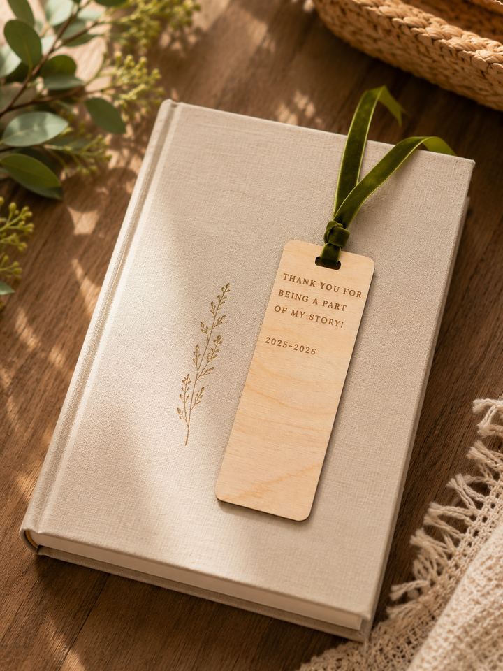 Book with a wooden bookmark on a wooden surface