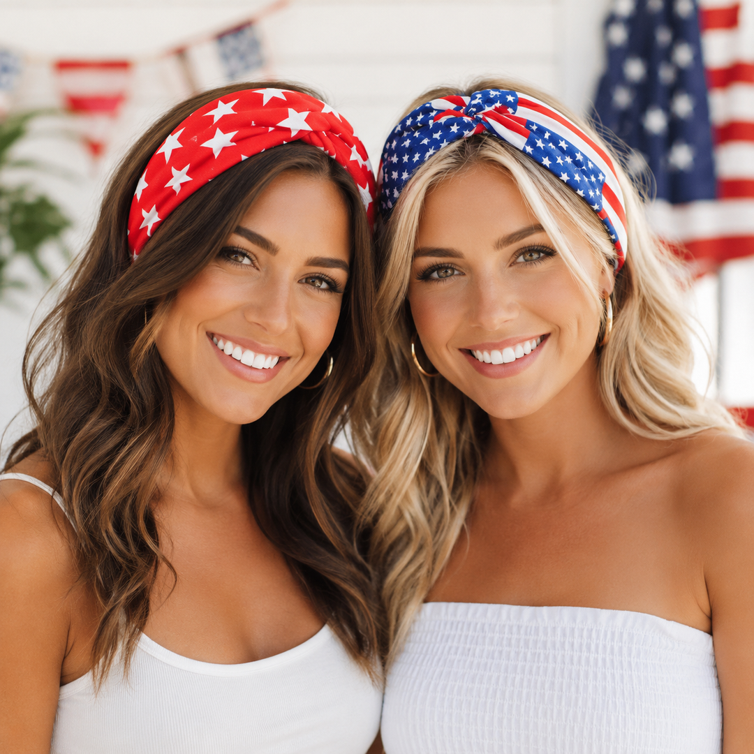 Two women wearing American flag headbands with a blurred background of flags.