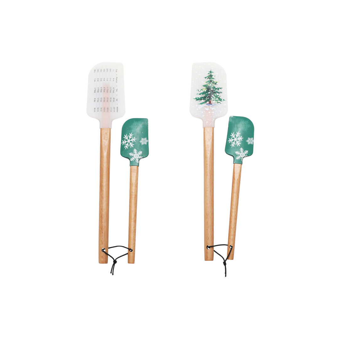 Four spatulas with Christmas-themed designs on a white background