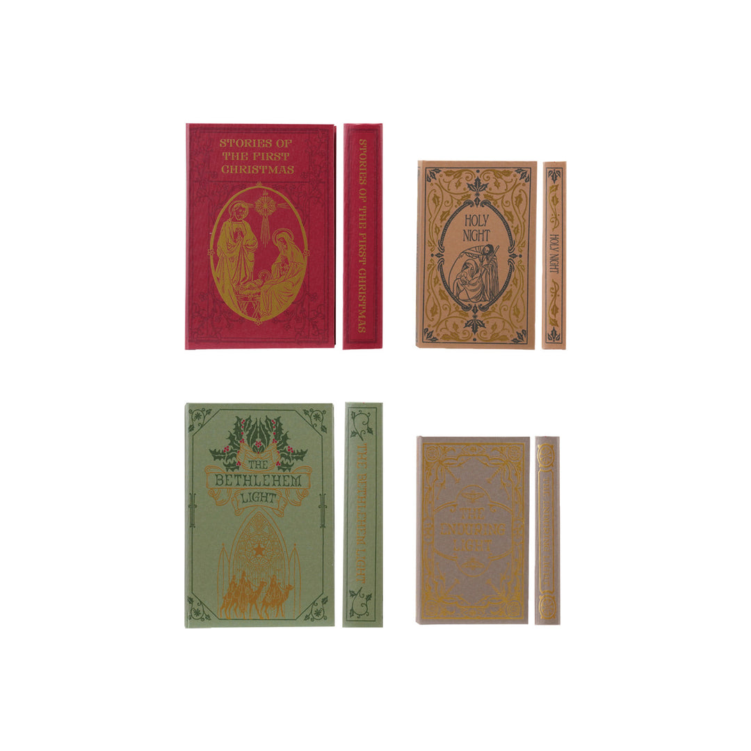 Set of vintage-style books with decorative covers on a white background