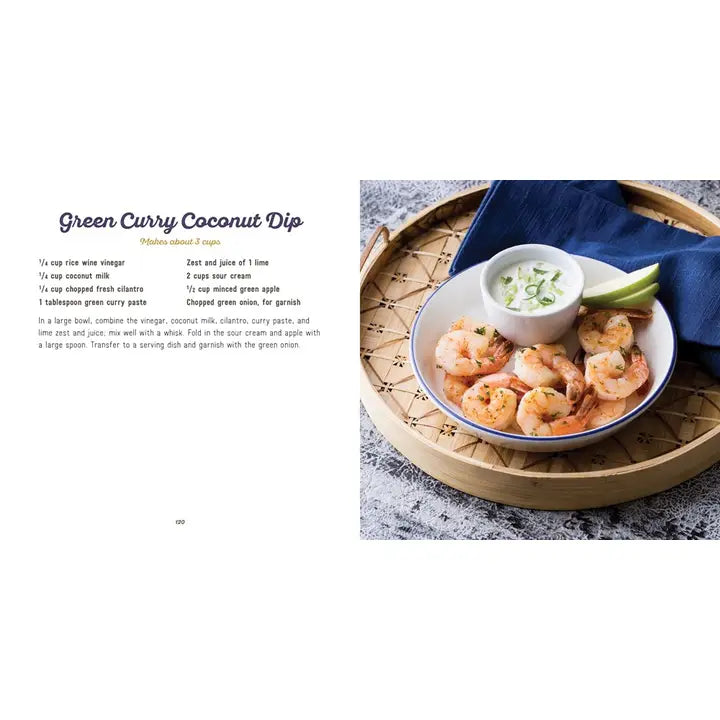 A recipe-style page showing the title 'Green Curry Coconut Dip' with ingredients listed on the left and a plated food photo on the right. The photo shows shrimp, a small bowl of white dipping sauce, green onions, and lime on a round tray with a dark blue cloth.