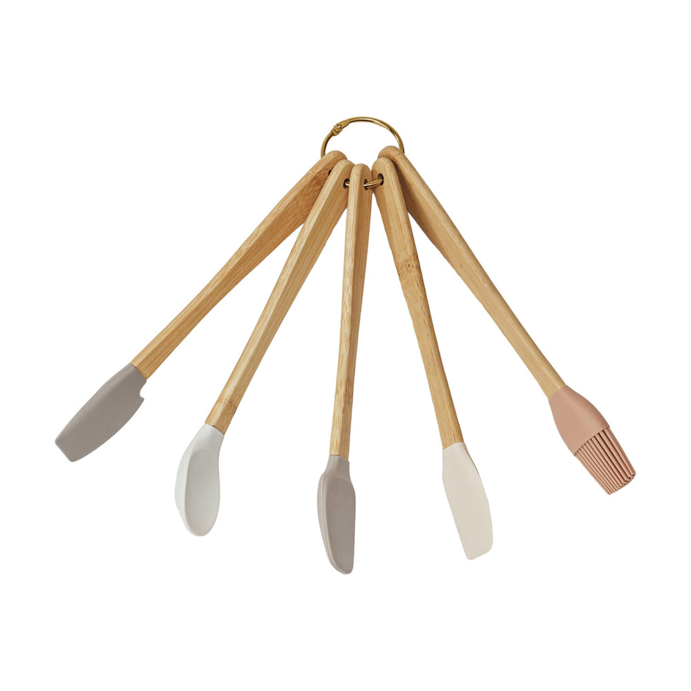 Set of five wooden utensils with silicone ends on a white background