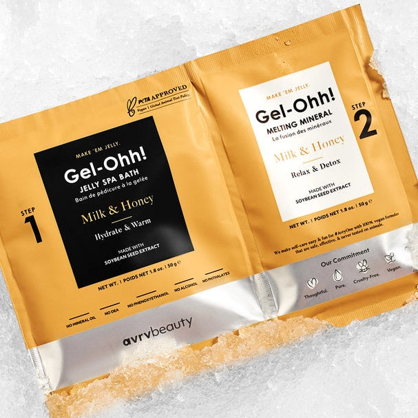 Two Gel-Oh! milk and honey packets on a white background