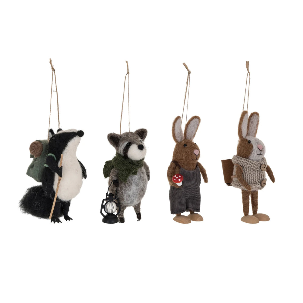 Set of four animal ornaments hanging on a white background