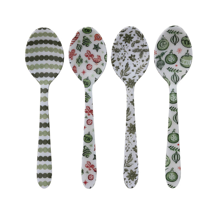 Four patterned spoons on a white background