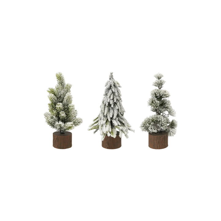 Three small potted artificial Christmas trees with snow effects on a white background