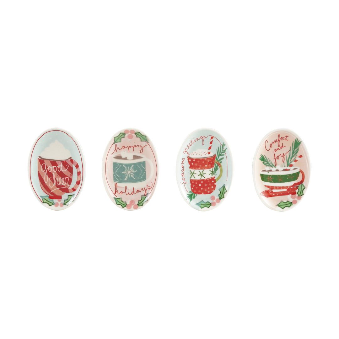 Set of four decorative spoons with holiday-themed designs on a white background