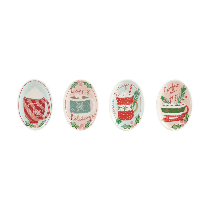 Set of four decorative spoons with holiday-themed designs on a white background